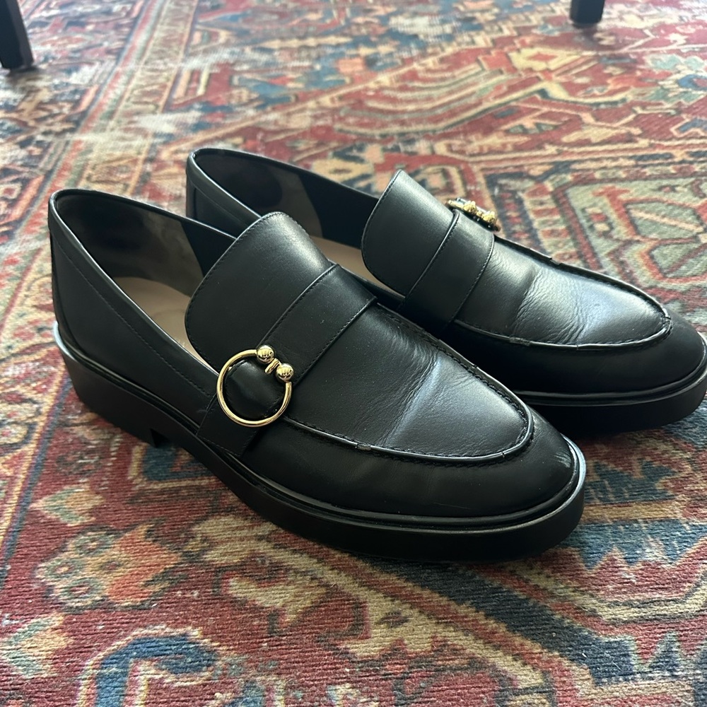 Black Leather Stuart Weitzman Women’s Loafers with Gold Accent